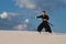 Man training martial arts, iaido, in desert