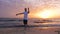 Man training Taijiquan on sea beach during beautiful morning sunrise