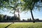 Man Training With Trickline Slackline In City Park