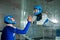 A man trains a woman as an astronaut. Classes on flying in a wind tunnel.