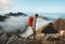 Man traveler hiking with backpack above clouds travel outdoor in mountains