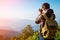 Man Traveler with photo camera and backpack