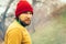 Man Traveler portrait beard face and hat alone in forest