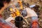 Man traveler pours water from a bottle into a metal mug.