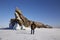 A man traveler stands at the Dragon Rock on Ogoy Island.