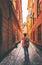 Man traveler walking alone in Stockholm narrow street