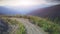 Man Traveler walking sunset mountain road