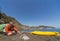 A man traveling by canoe along the coast