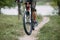 Man traveling riding a bicycle at country road.