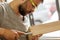 Man treating a wooden product with a chisel