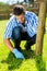 Man trimming grass home