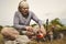 Man on trip relaxing and cooking in nature