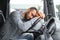 Man trucker tired driving in a cabin of his truck
