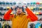 Man trying on helmet for ski or snowboarding