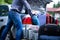 Man trying to fit all suitcases into car trunk