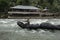 Man tubing down the river. Bukit Lawang, Sumatra, Indonesia.