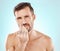 Man with tweezer, grooming nose hair and morning routine for beauty and skincare isolated on blue background. Face