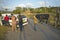 Man with two oxen pulling sled past broken down Fiat car in the Valle de Viï¿½ales, in central Cuba