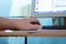 Man typing on computer keyboard with his left hand, remote work at home,