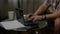 Man typing at home desk