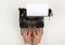 Man typing on vintage retro typewriter on white table background top view flat lay from above - journalism, application or writer