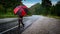 Man with umbrella on road with hail