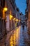 A man with an umbrella on the street.