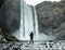 Man under waterfall in Iceland, Adventure photo, edit space