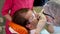 Man undergoing teeth polishing in dental clinic