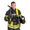 Man in uniform of firefighter holds hardhat, pinch bar, fire hose