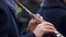 Man in uniform skillfully playing oboe accompanied by brass band, performance