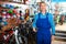 man in uniform working in bicycle shop .