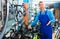 Man in uniform working in bicycle shop