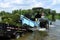 Man unloads lake weed harvester weeds