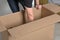 Man unpacks a box and takes things out of it