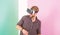 Man unshaven guy with VR glasses, pink background. Enjoy virtual reality. Hipster use modern technologies for