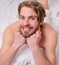 Man unshaven handsome happy smiling torso relaxing bed. Man feel full of energy after pleasant night dream. Guy