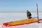 Man unwinding slings at kite on snow, Novosibirsk,Russia