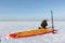 Man unwinding slings at kite on snow, Novosibirsk,Russia