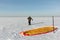 Man unwinding slings at kite on snow, Novosibirsk,Russia