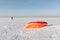 Man unwinding slings at kite on snow, Novosibirsk,Russia