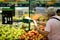 A man uses biodegradable plastic food bags to buy fruits and vegetables from the supermarket