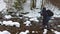 A man uses a camera to capture a mountain stream in the Carpathians