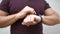 A man uses a fitness bracelet by tapping on the screen.