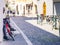 A man usign his phones and earphones in the street connected by wireless communication, Italy, Cremona 28th may 2017