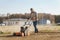 Man using aerator machine to scarification and aeration of lawn or meadow