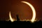 Man using binoculars to watch solar eclipse