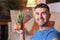 Man using a cactus to absorb radiation at home