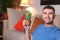 Man using a cactus to absorb radiation at home