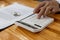 Man using a calculator, a housing project salesman is pressing a friend`s calculator to calculate expenses on the day of signing